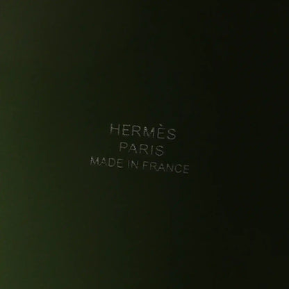 Green leather interior with embossed text reading PARIS and MADE IN FRANCE