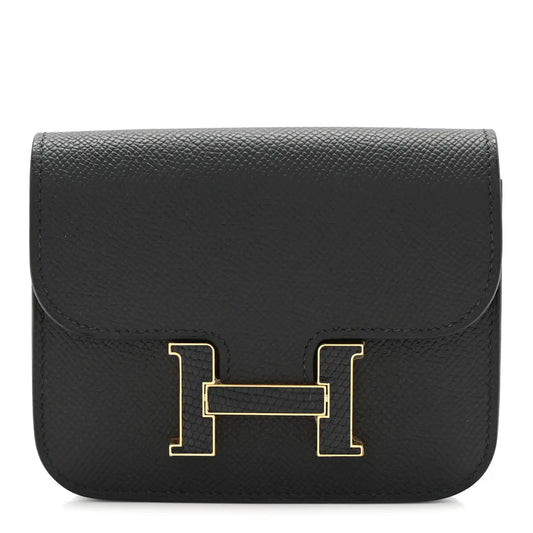 Black slim wallet with gold H clasp, textured epsom leather foldover