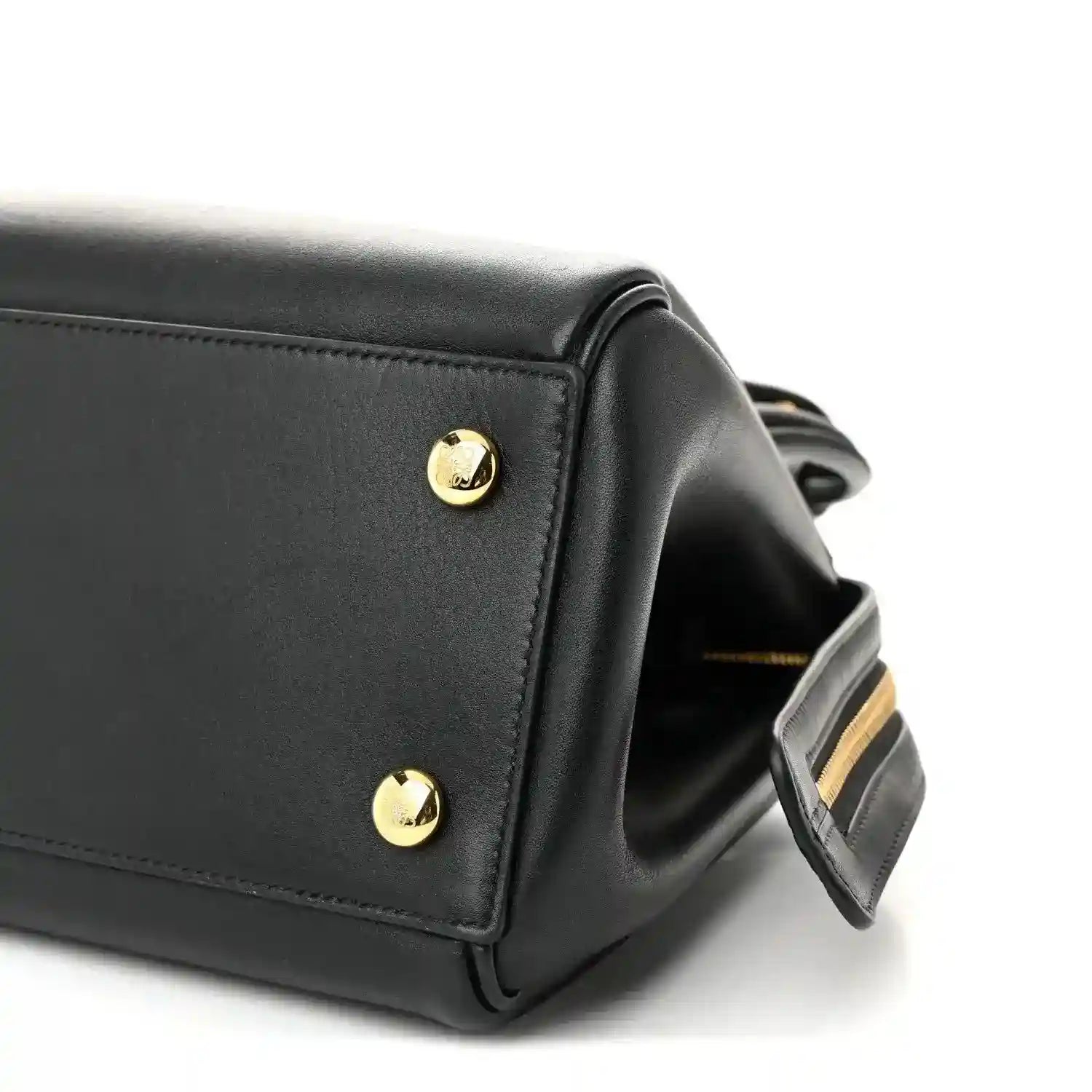 Black Small Madrid bag corner with gold stud and attached shoulder strap detail.