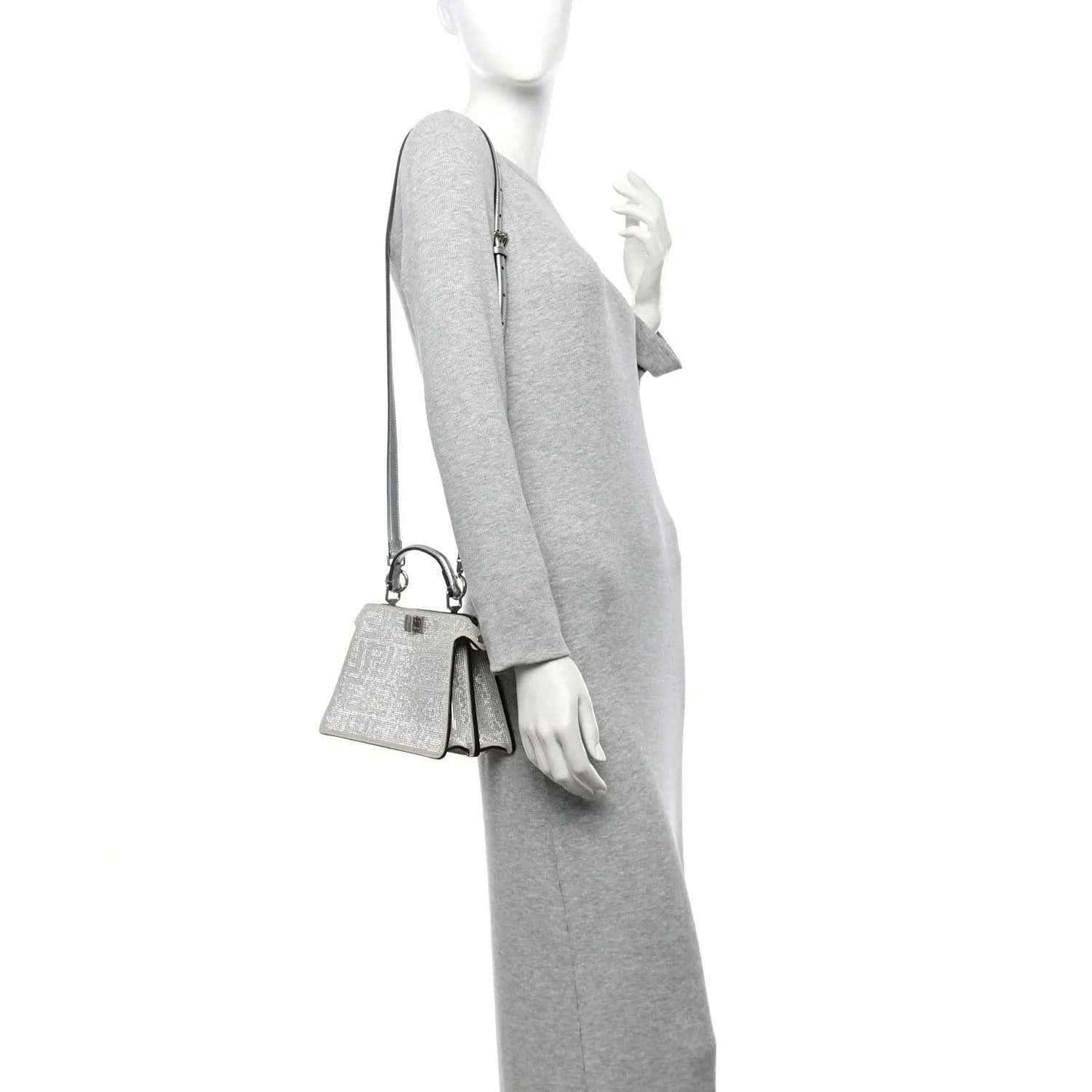 Silver crystal mini satchel worn crossbody with thin shoulder strap