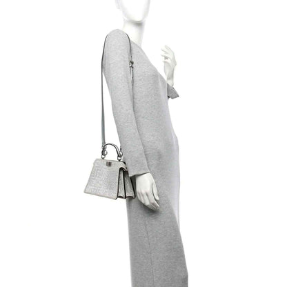 Silver crystal mini satchel worn crossbody with thin shoulder strap