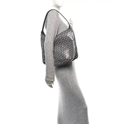 Grey coated canvas hobo bag side view with top handle and structured shape