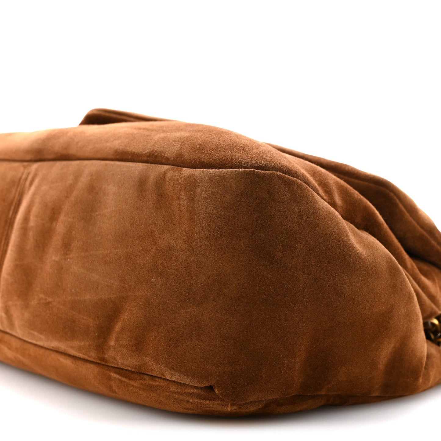 Saint Laurent suede shoulder bag back close-up in caramel cognac with panel stitching.