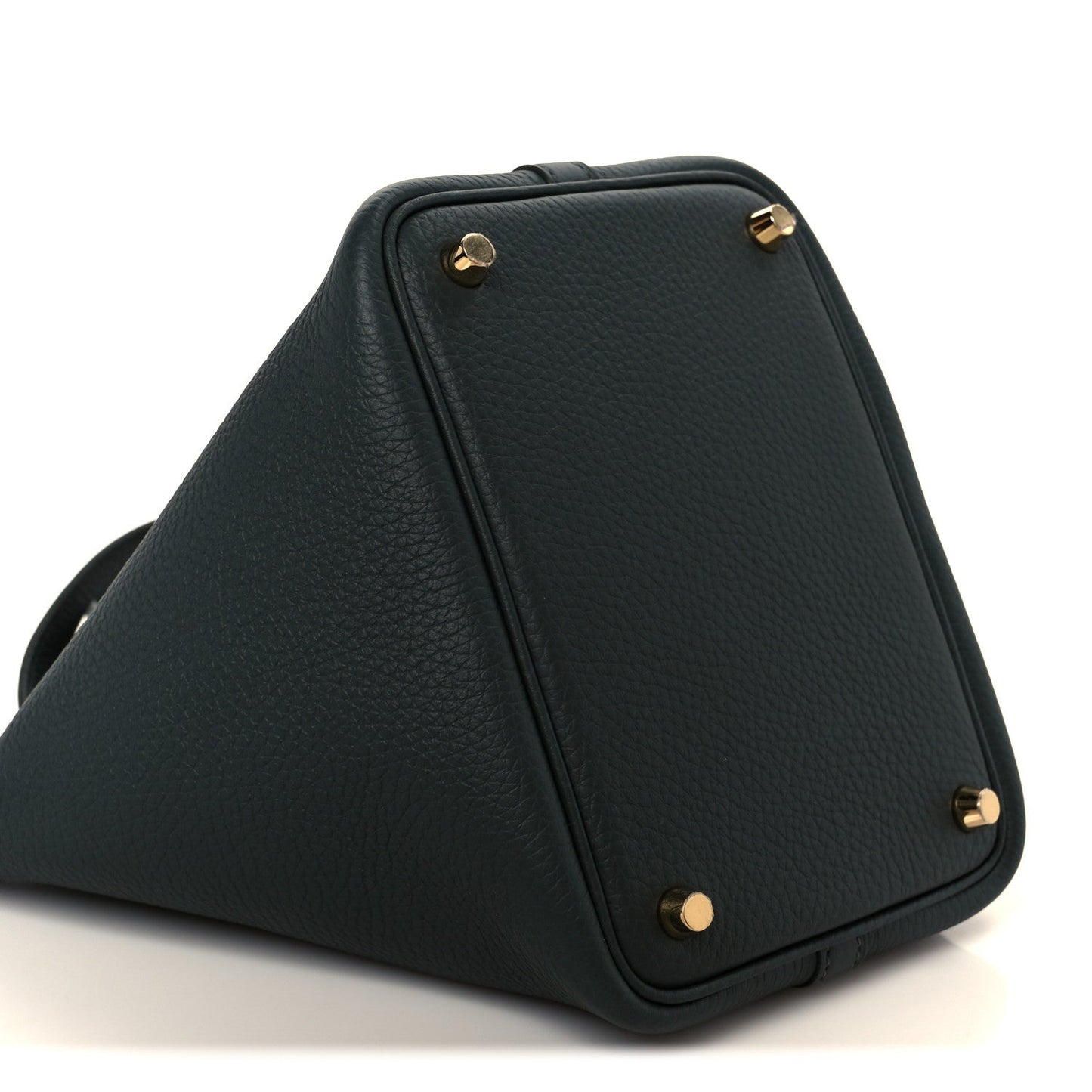 Dark green leather tote bag with gold-tone corner studs and structured sides