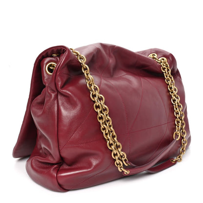 Dark bordeaux lambskin shoulder bag with gathered flap, gold chain strap, and stitching