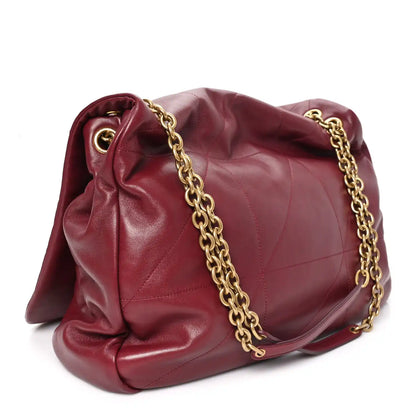 Dark bordeaux lambskin shoulder bag with gathered flap, gold chain strap, and stitching