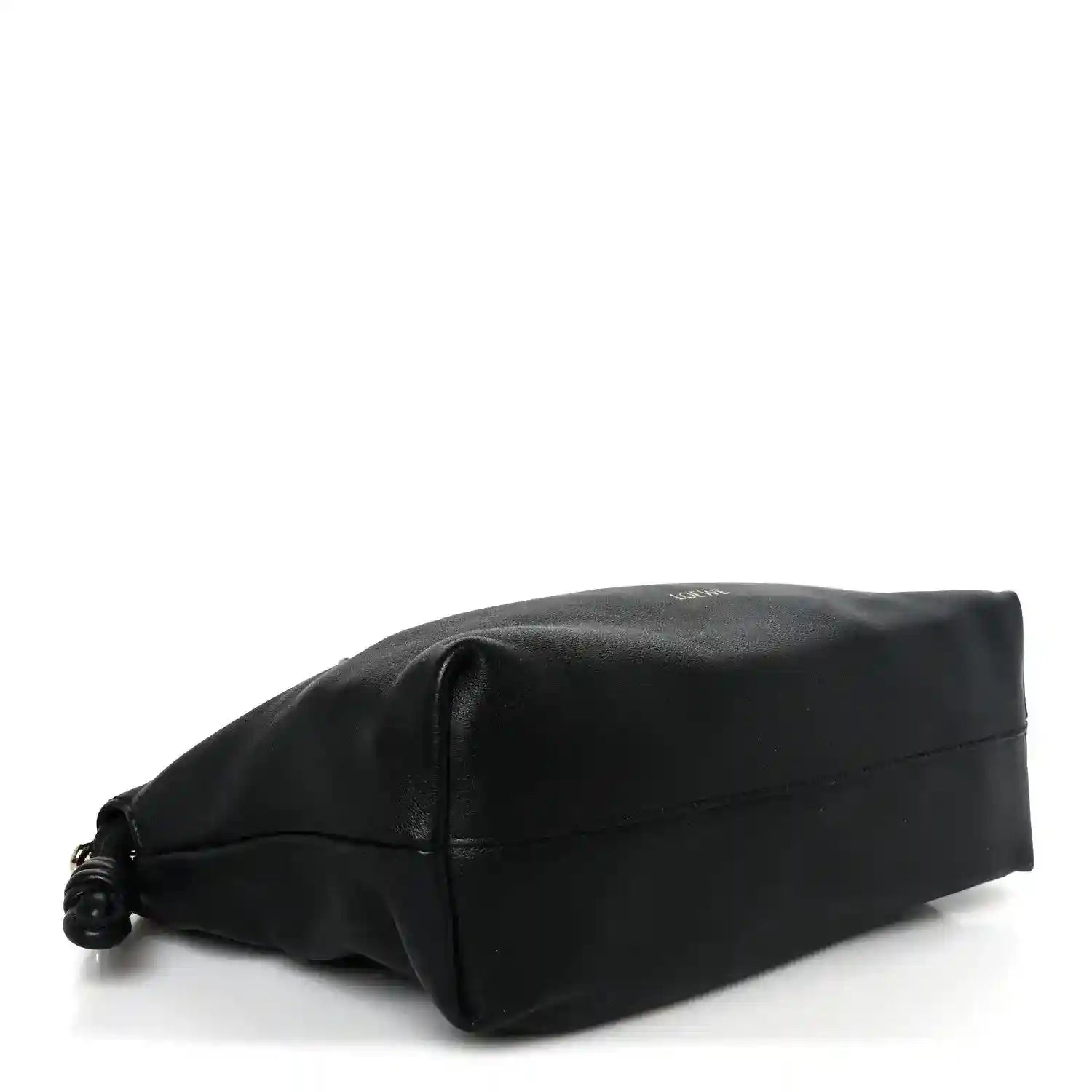 Black leather clutch bottom view with rounded corners and small twisted drawcord detail.