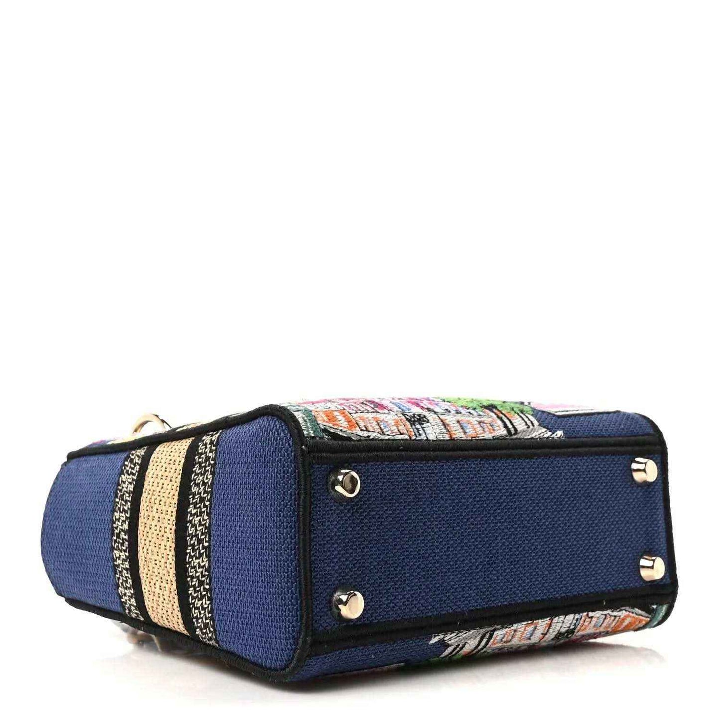 Blue small handbag with striped embroidered trim, top tab, and metal stud details