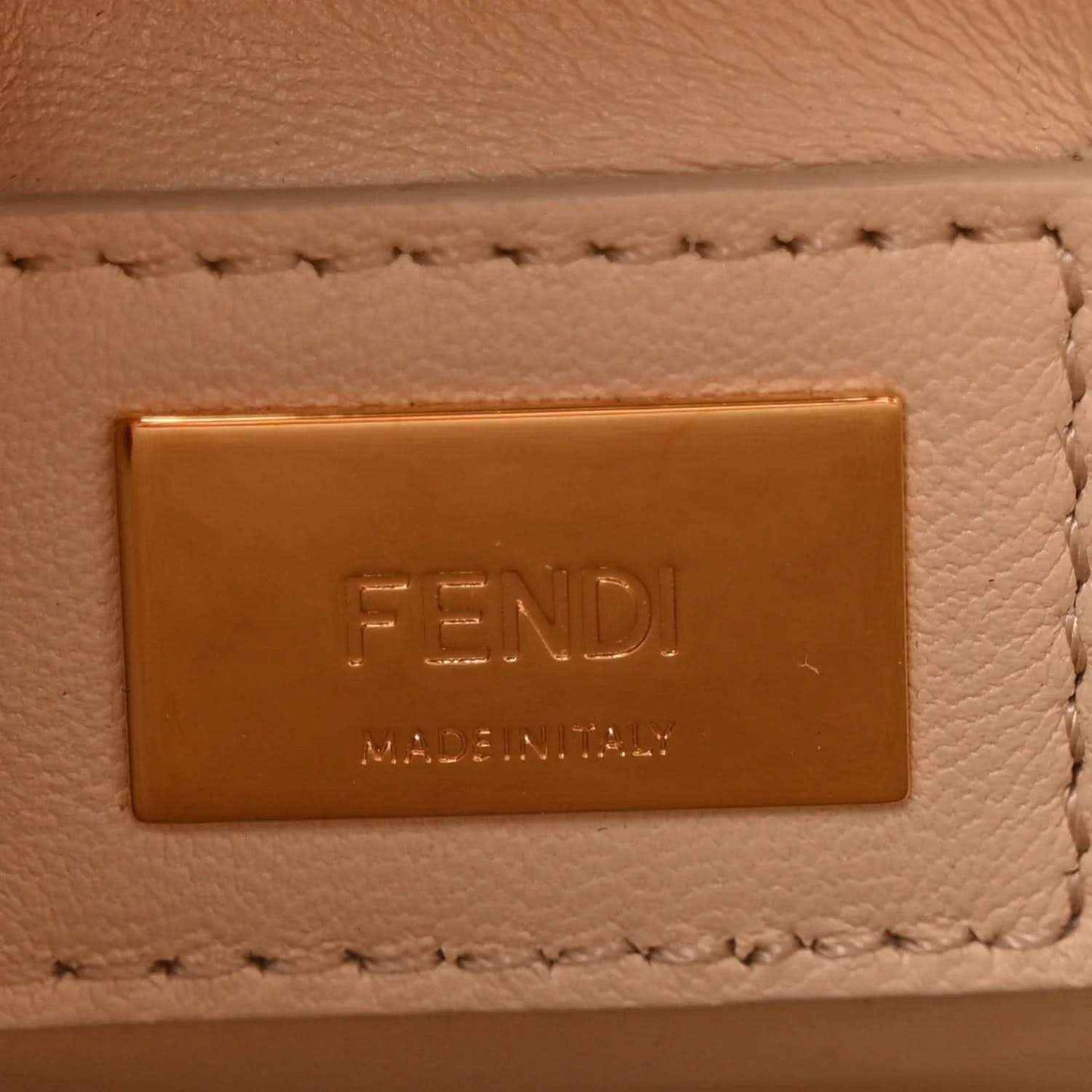 Fendi embossed logo patch on cream leather satchel with stitched trim