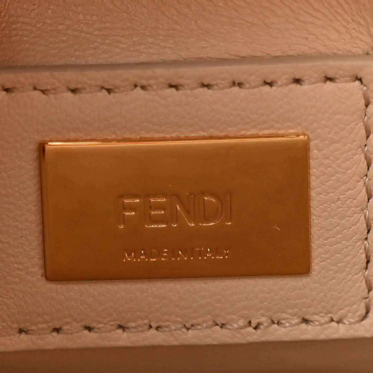 Fendi embossed logo patch on cream leather satchel with stitched trim