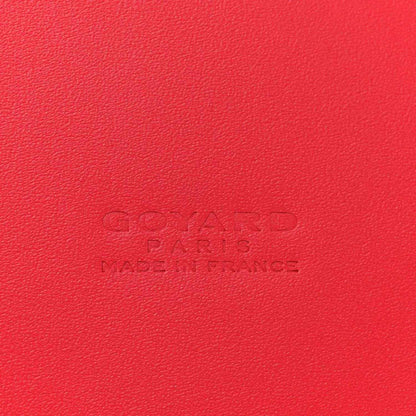 Red leather handbag panel with embossed Goyard Paris branding