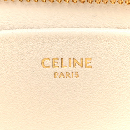 Celine Paris text on light rice cream leather with zipper edge