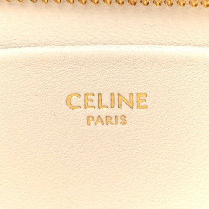 Celine Paris text on light rice cream leather with zipper edge