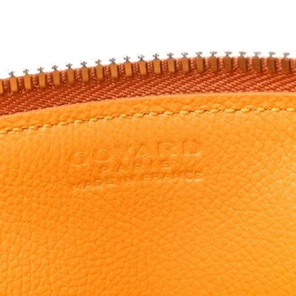 Orange leather top trim detail with embossed Goyardine logo and braided stitch line