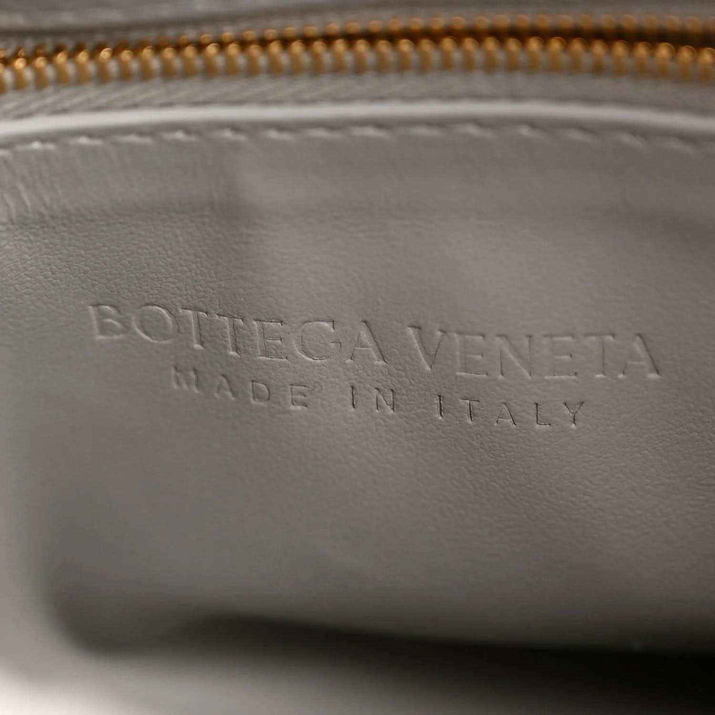 Bottega Veneta suede interior panel with embossed lettering