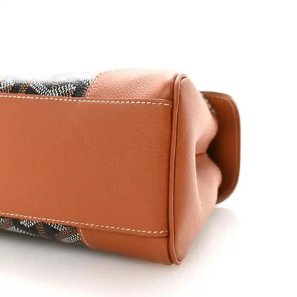 Mini Saigon shoulder bag end close-up, tan leather flap and contrast stitching
