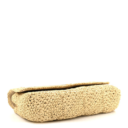 Natural raffia shoulder bag with beige leather trim and curved top edge
