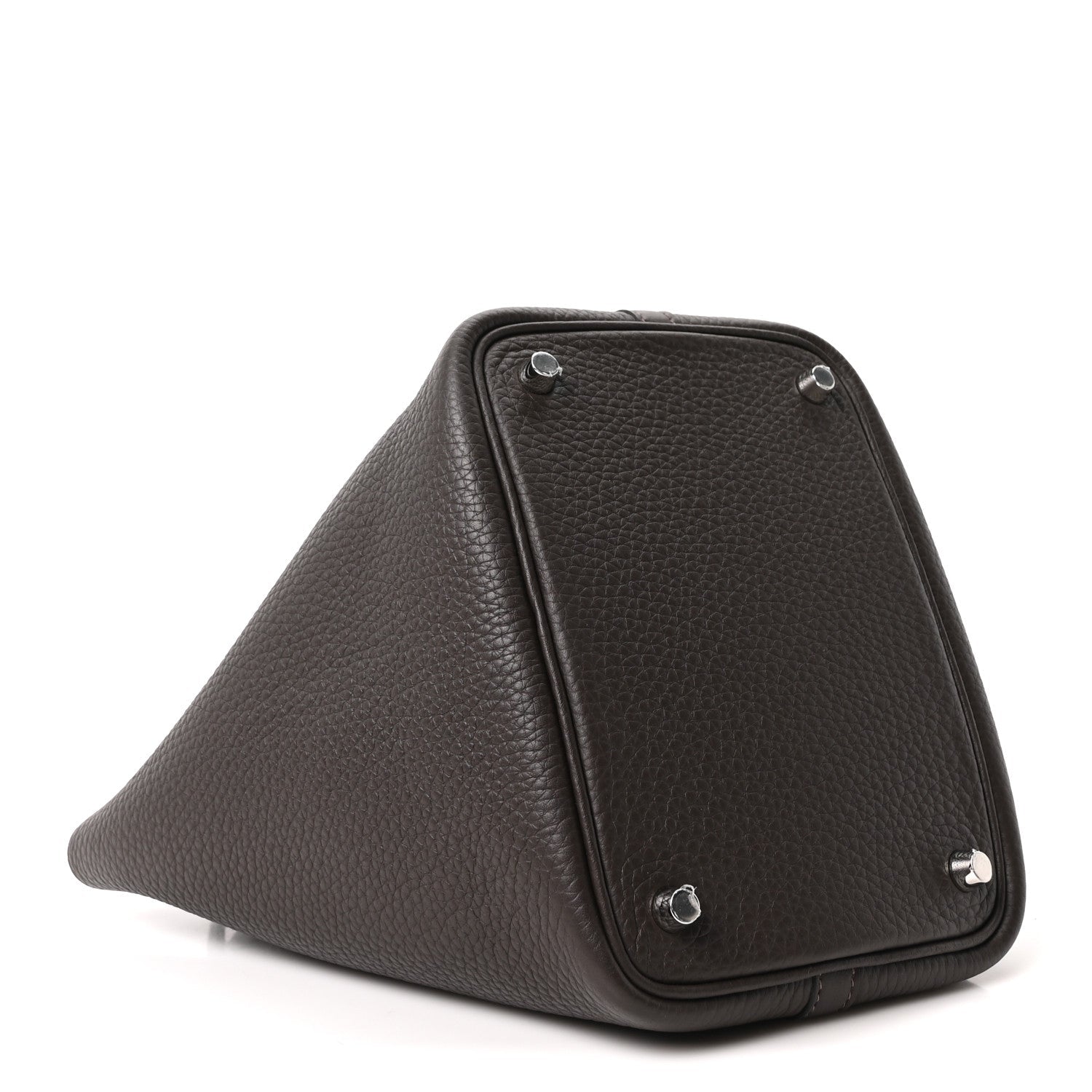 Dark brown leather tote bag with triangular profile and top lock hardware on corner