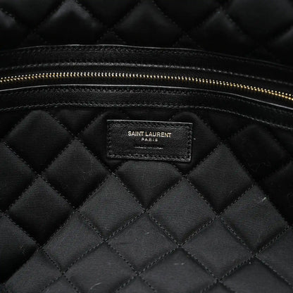 Black quilted lining with Saint Laurent PARIS brand patch and gold zipper