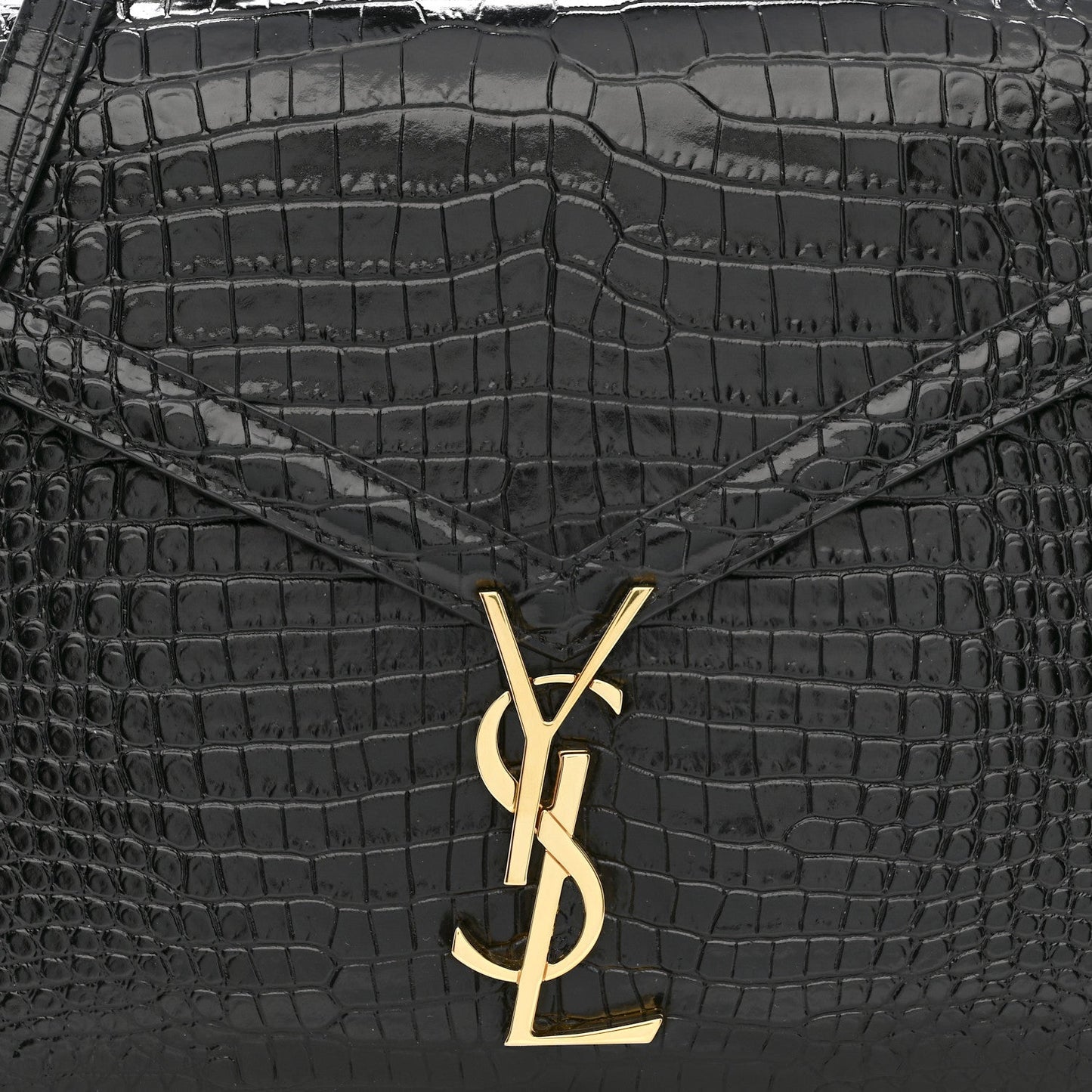 Black crocodile-embossed bag front with gold YSL logo clasp