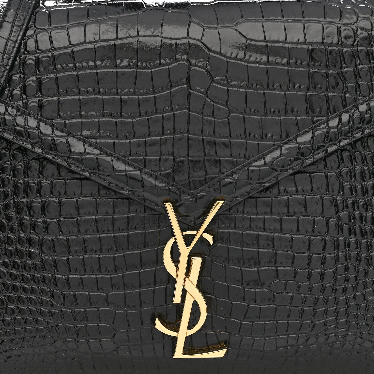 Black crocodile-embossed bag front with gold YSL logo clasp