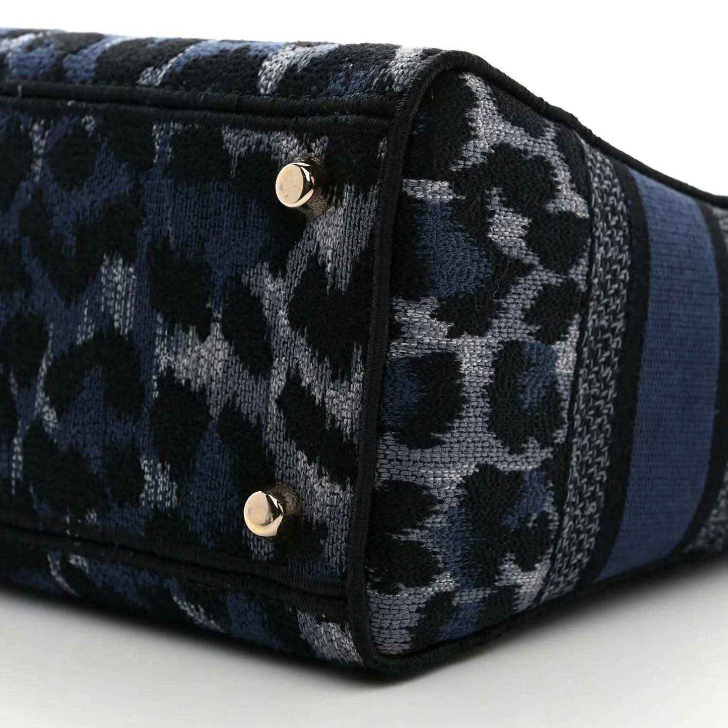 Christian Dior handbag front panel with leopard canvas and gold snap hardware