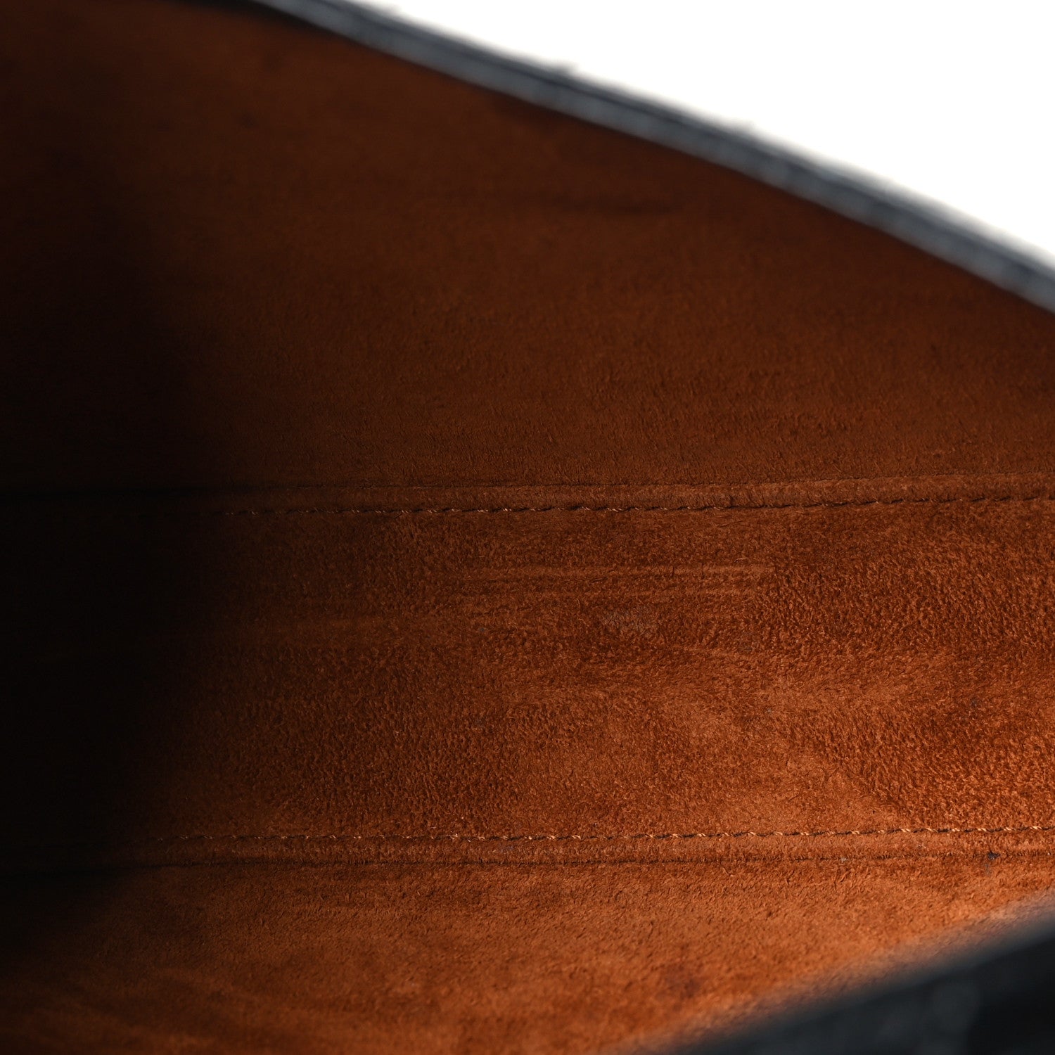 Brown leather interior lining with stitched seam detail