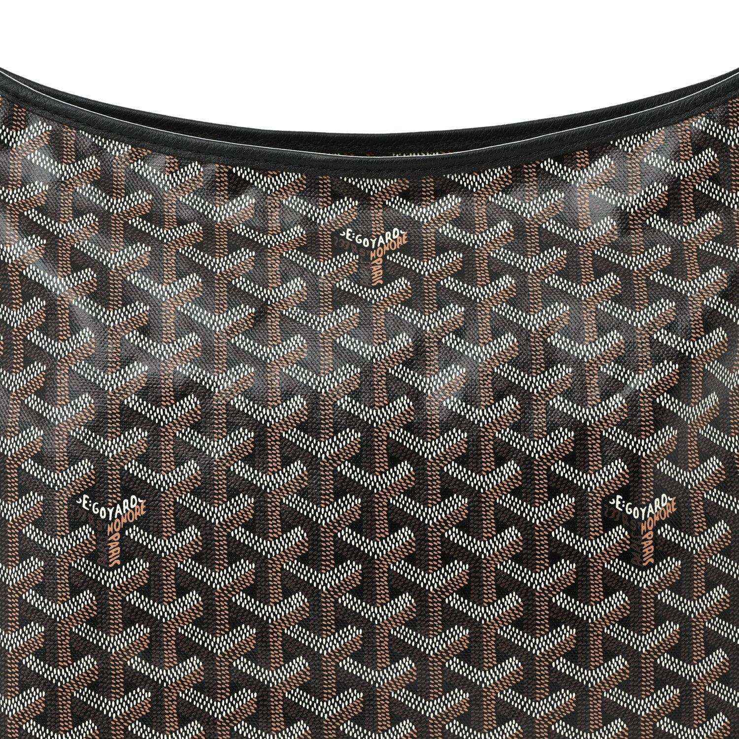 Close-up chevron fabric of hobo shoulder bag with repeating monogram pattern