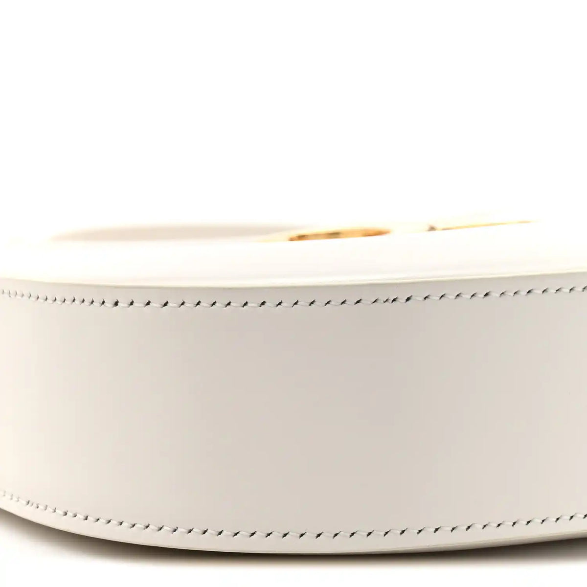 Close-up of rice cream bag side with gold-tone zipper pull and stitched trim