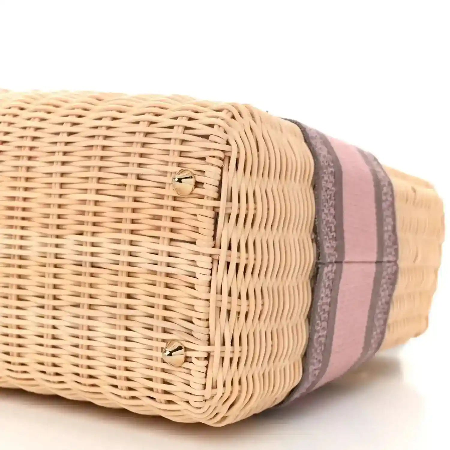 Wicker bag end with pink and gray striped trim and gold stud detail
