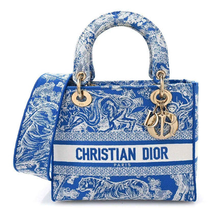 Christian Dior medium tote bag in blue and white toile print with top handles and gold hardware