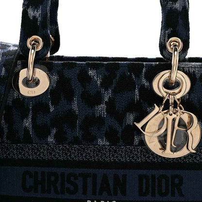 Christian Dior handbag with top handles, Dior charm, and logo panel