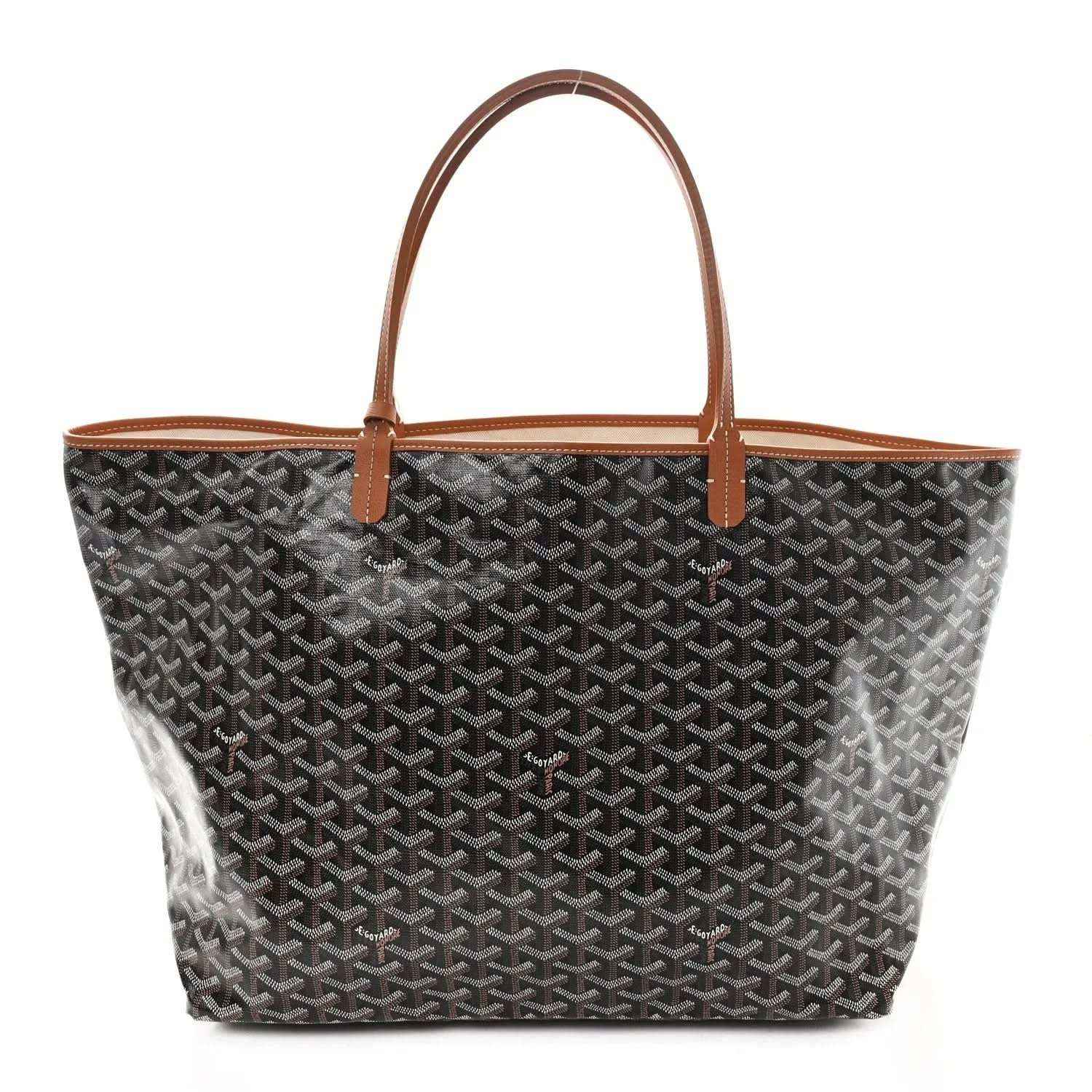 Black monogram tote bag with tan leather handles and trim