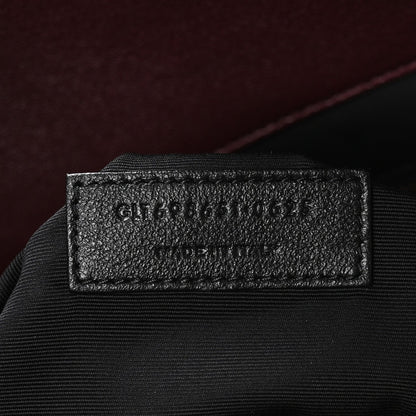 Leathery size tag on a quilted tote interior label area
