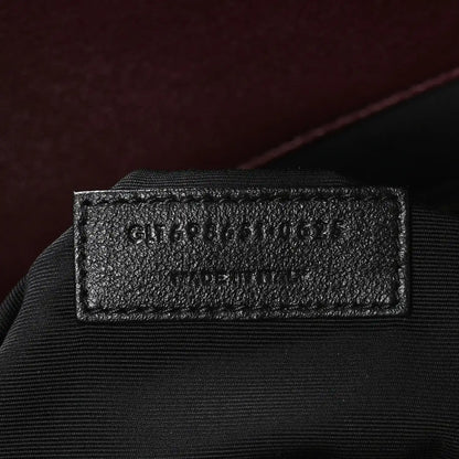 Leathery size tag on a quilted tote interior label area