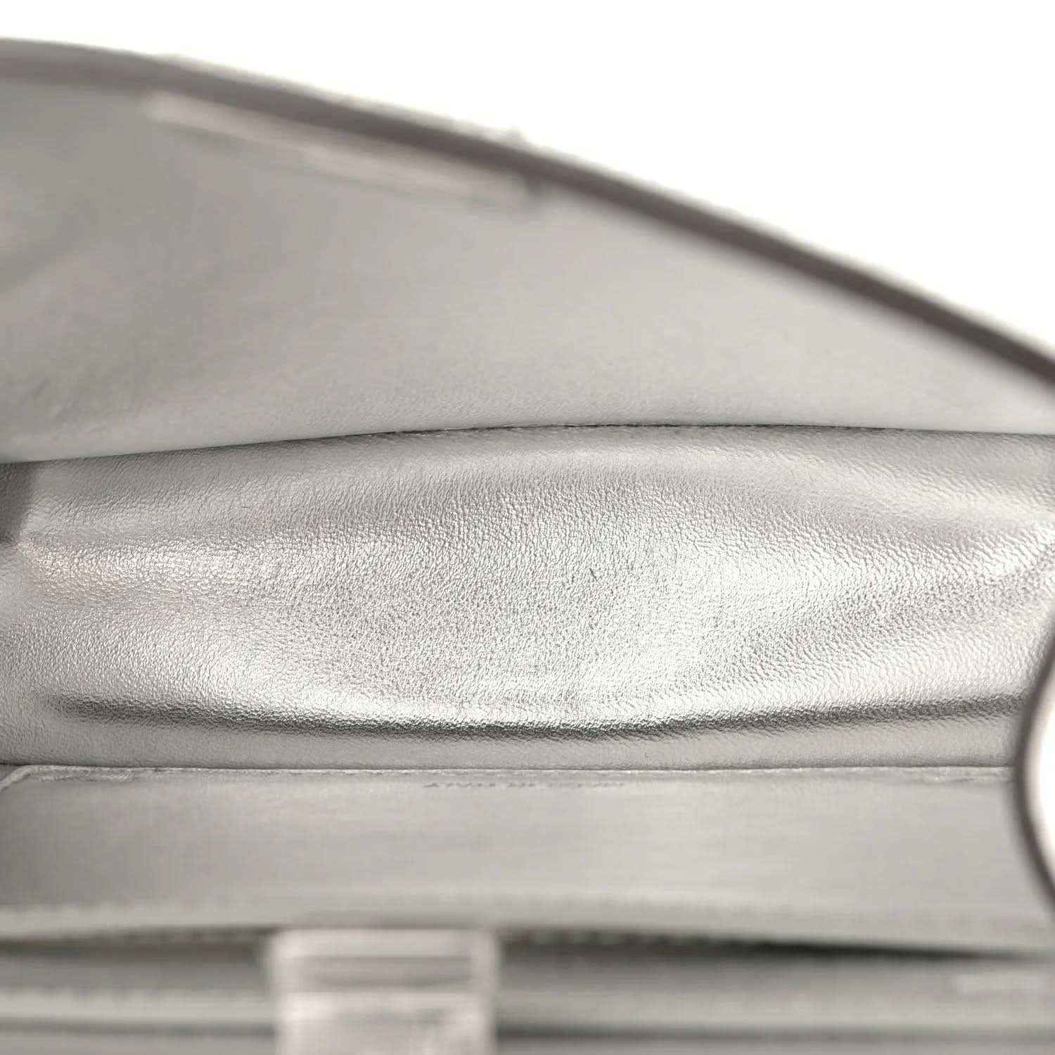 Light silver leather satchel lining with visible edge seam
