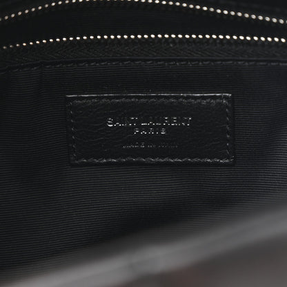 Black satin-lined interior pocket with stitched leather brand label inside satchel.