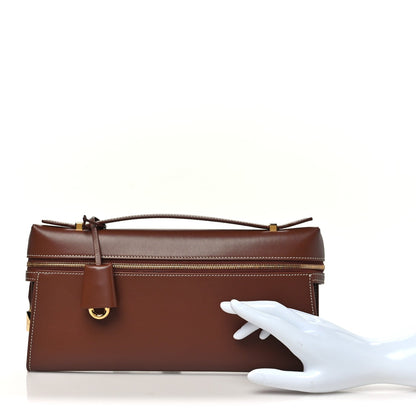 Loro Piana smooth calfskin clutch in burnt tan with front flap and gold hardware