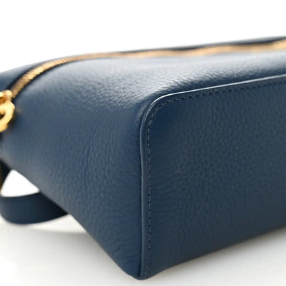Navy grained calfskin pouch corner with detailed edge stitching