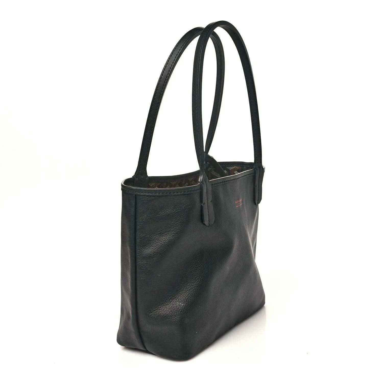 Mini tote bag side view in black leather with two top handles and stitched panel