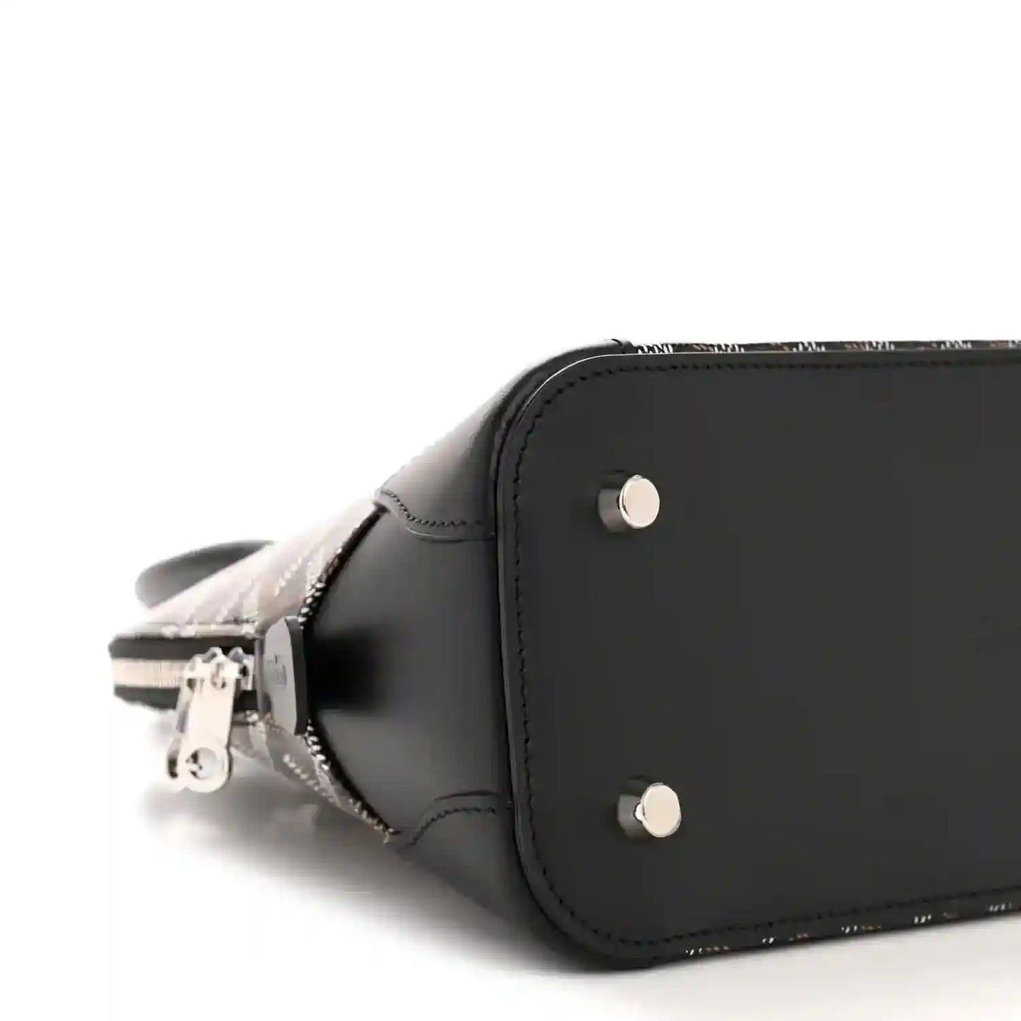 Black mini bag side view with silver rivets, smooth leather edge, and zipper pull