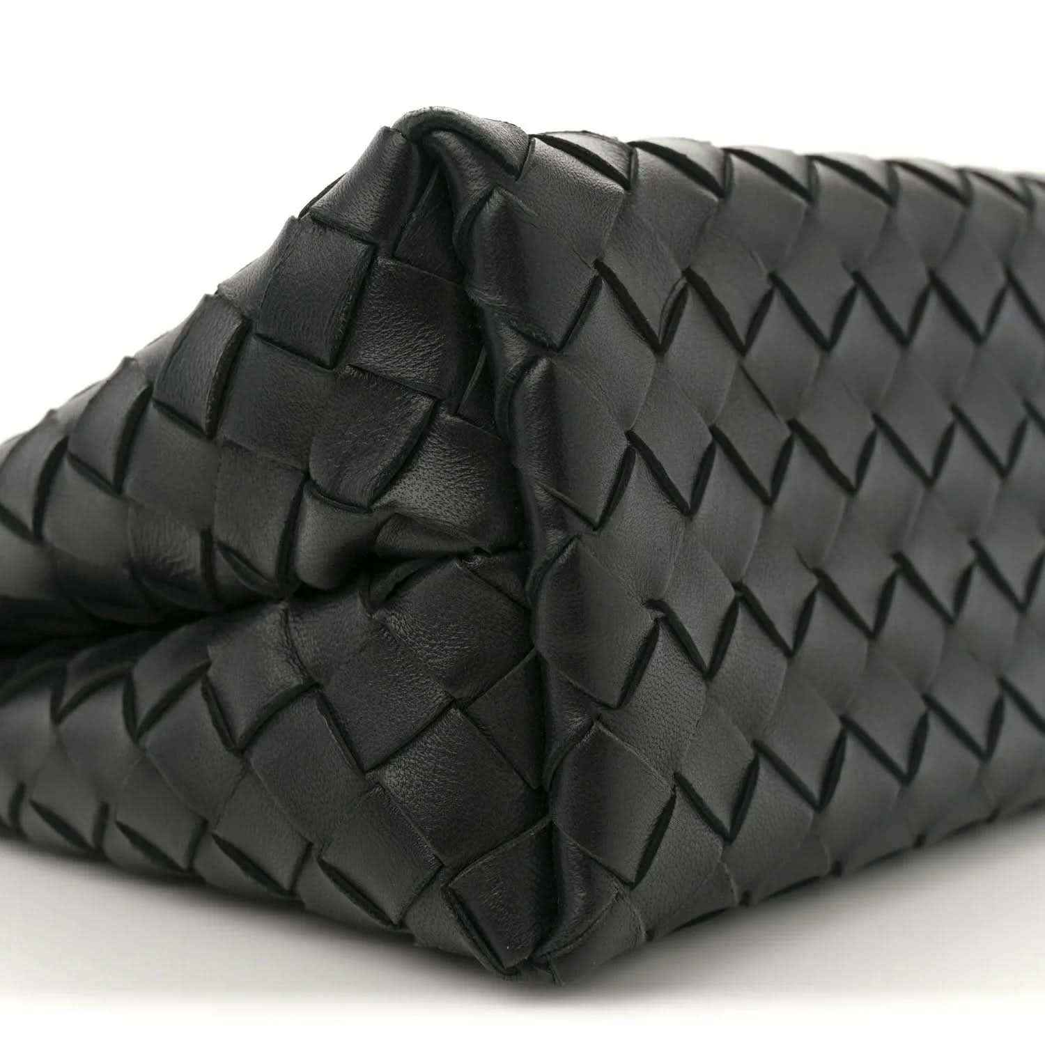 Black leather shoulder bag corner with raised intrecciato weave and quilted detail