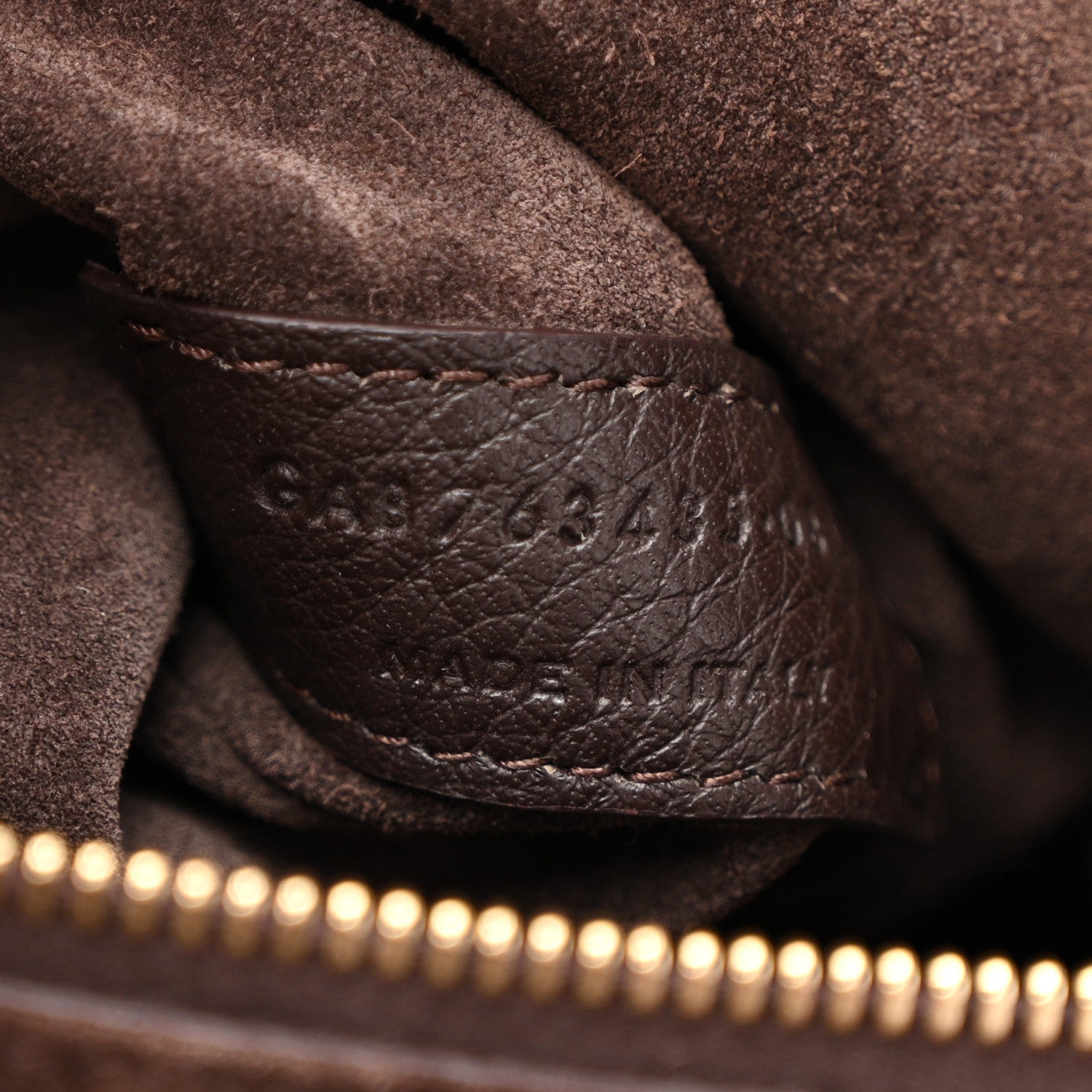 Leather seam detail on Bea tote with stamped numbers, dark grained deerskin