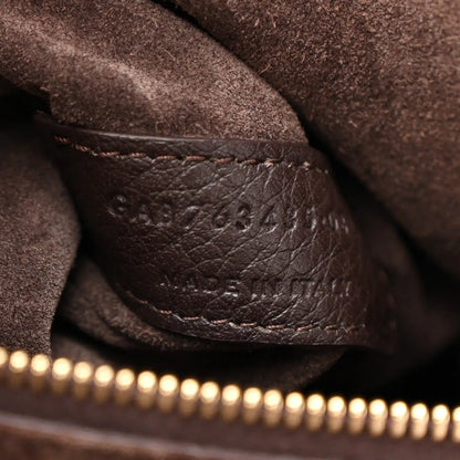 Leather seam detail on Bea tote with stamped numbers, dark grained deerskin