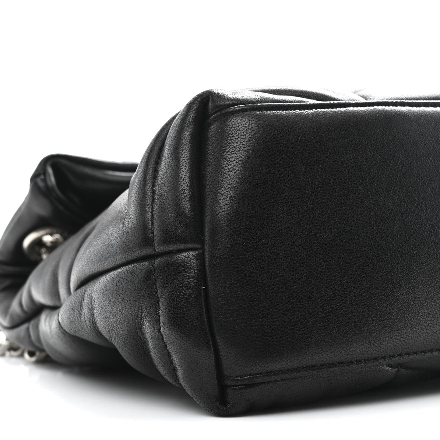 Black quilted lambskin puffer small satchel, structured flap and curved edge seam detail.