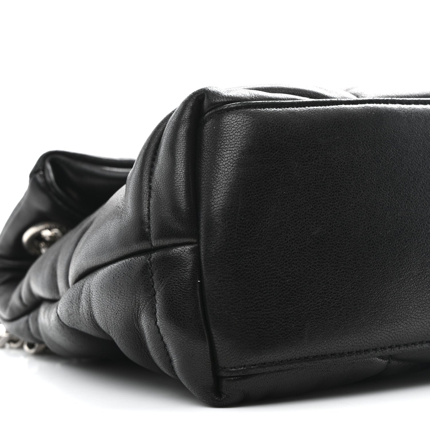 Black quilted lambskin puffer small satchel, structured flap and curved edge seam detail.