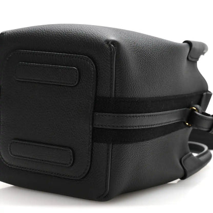 Black grained leather micro bale bag with flap panel and shoulder strap rings