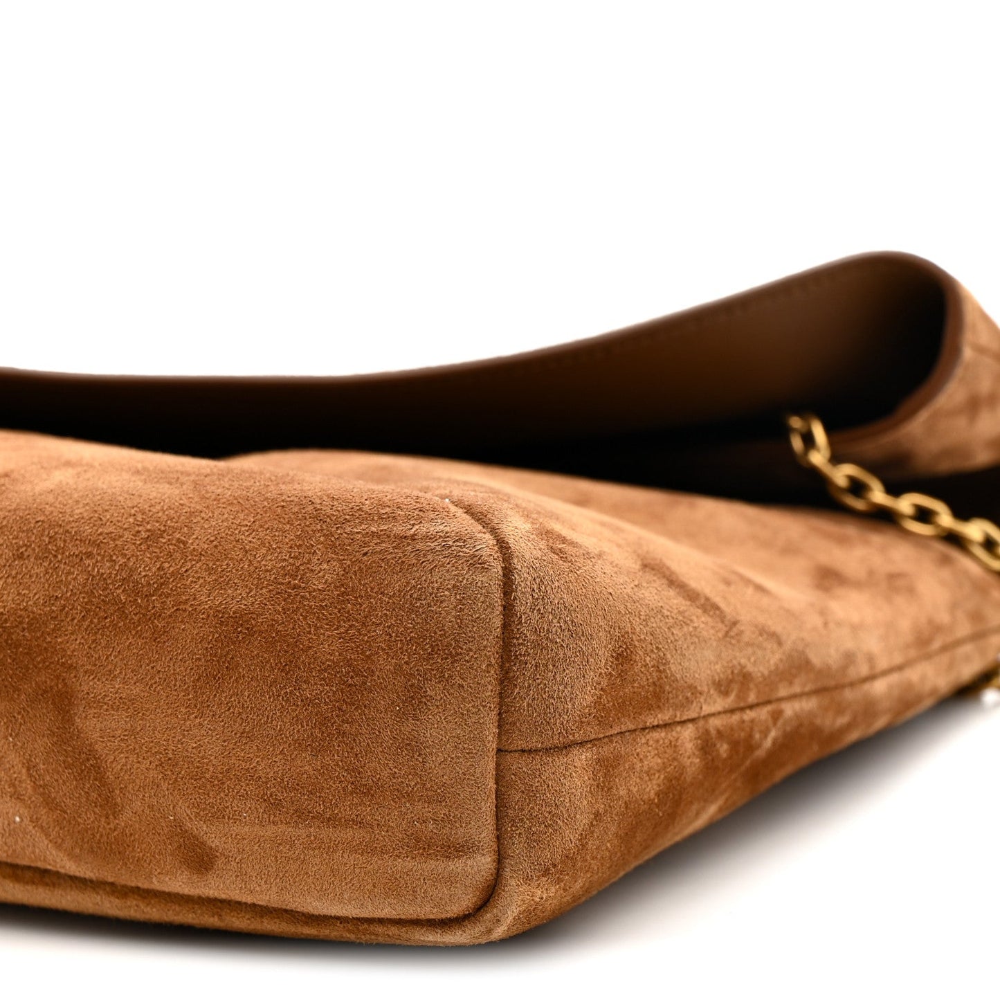 Caramel suede pouch on chain bag close-up of side seam and gold chain