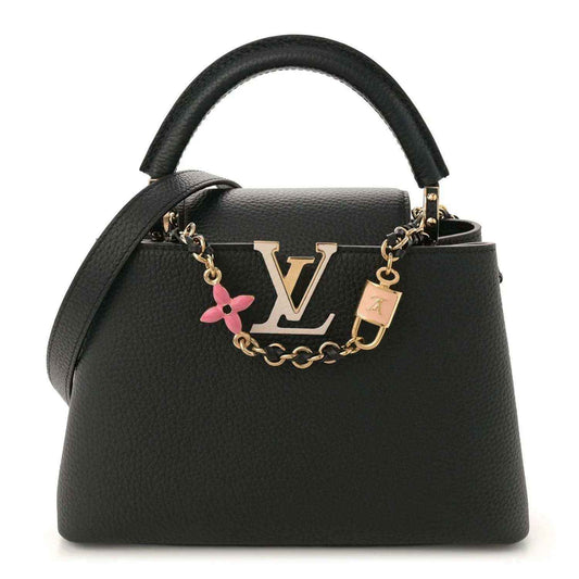 Black leather handbag with gold chain strap, top handle, and LV logo charm