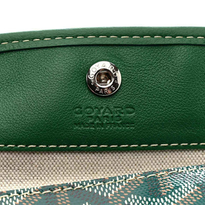 Green leather tote with round metal snap button and embossed logo
